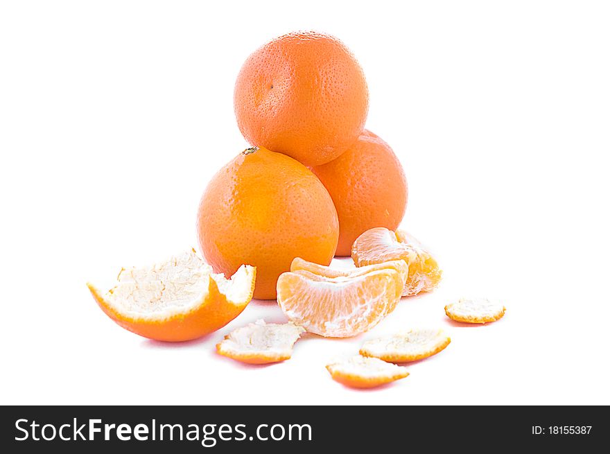 Pile of oranges, peels over white