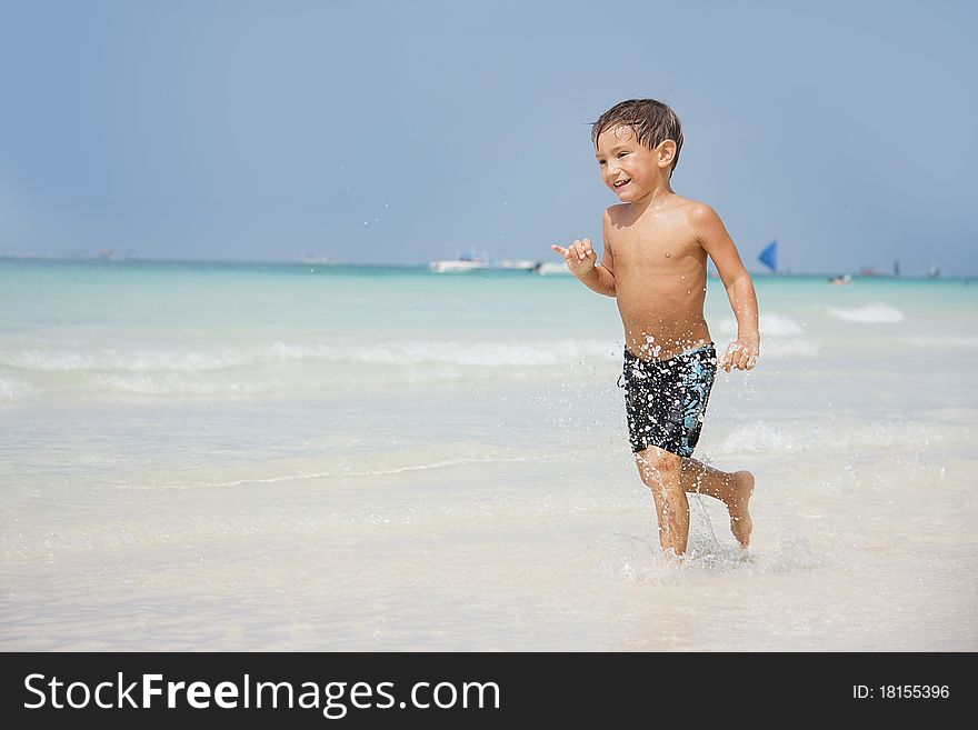 Boy Running On Beach