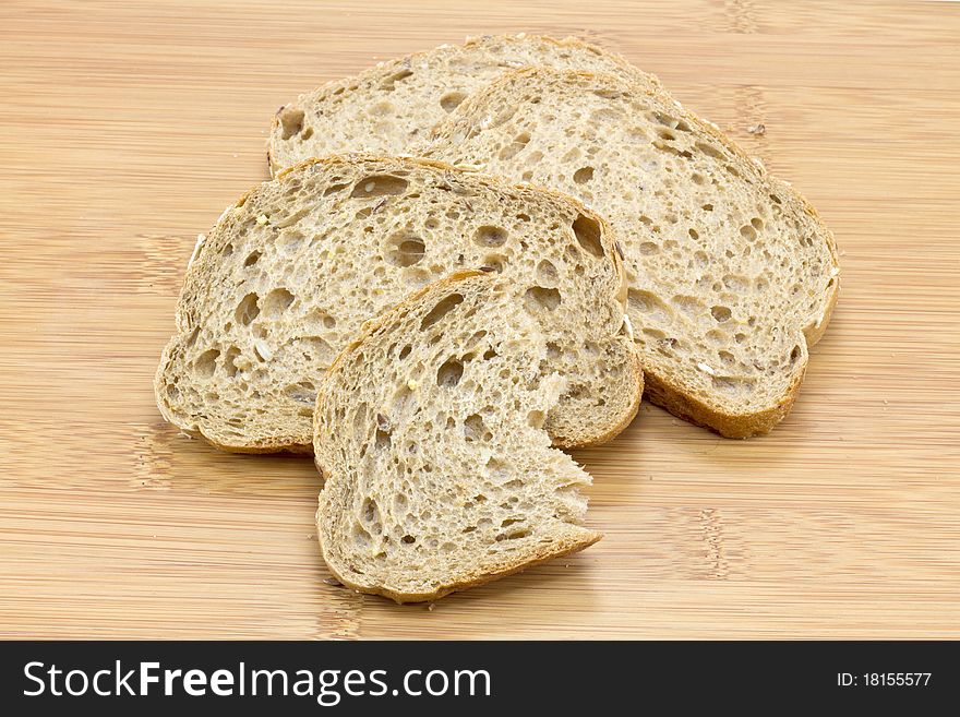 Sliced bread on wooden background