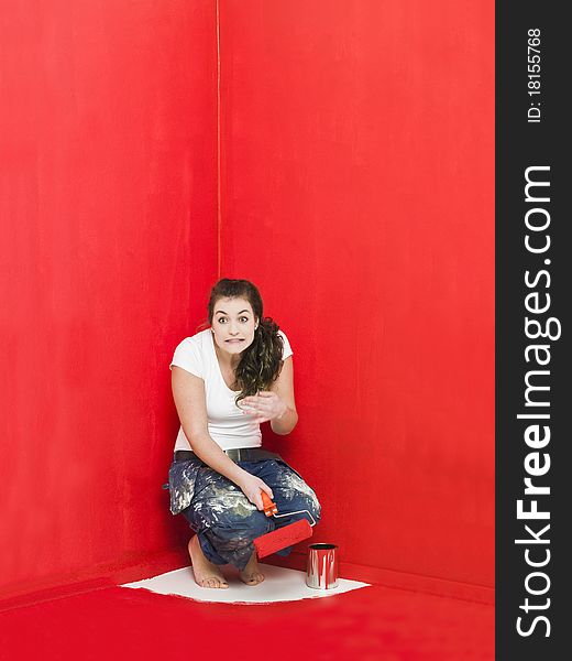 Girl has painted herself in the corner. Girl has painted herself in the corner