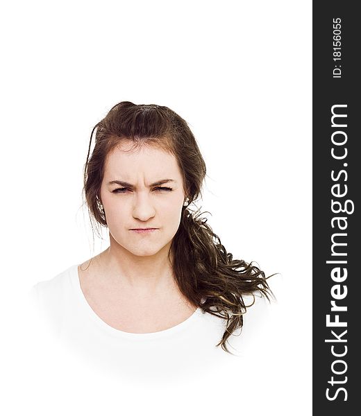 Young surly woman on white background