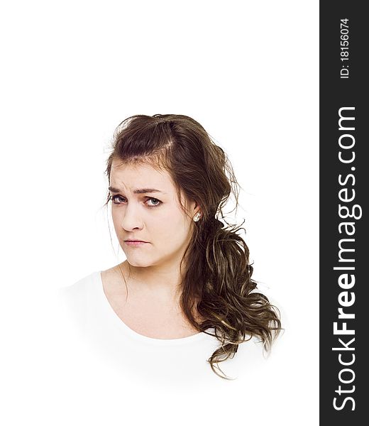 Young serious woman on white background