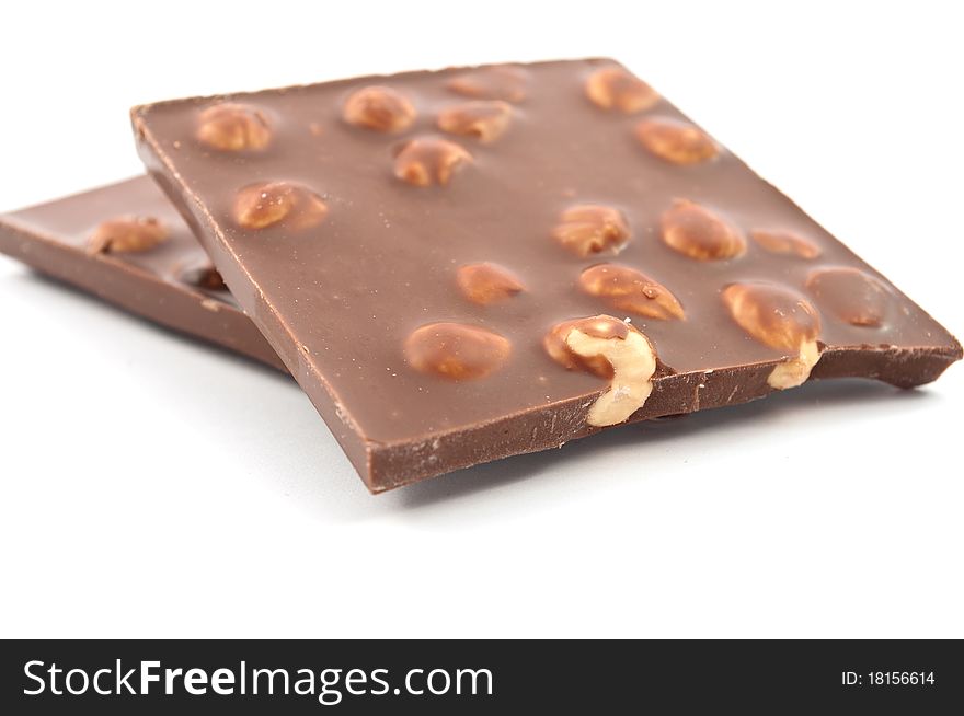 Chocolate with nuts on white background