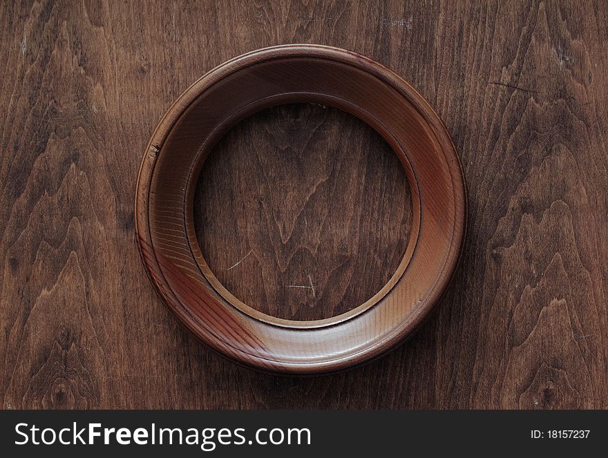 Blank frame on old wooden background