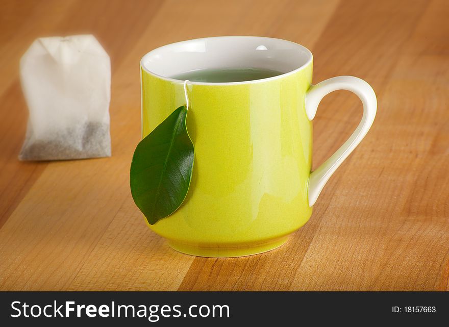 Natural herbal drink with a leaf for the teabag tag. Natural herbal drink with a leaf for the teabag tag