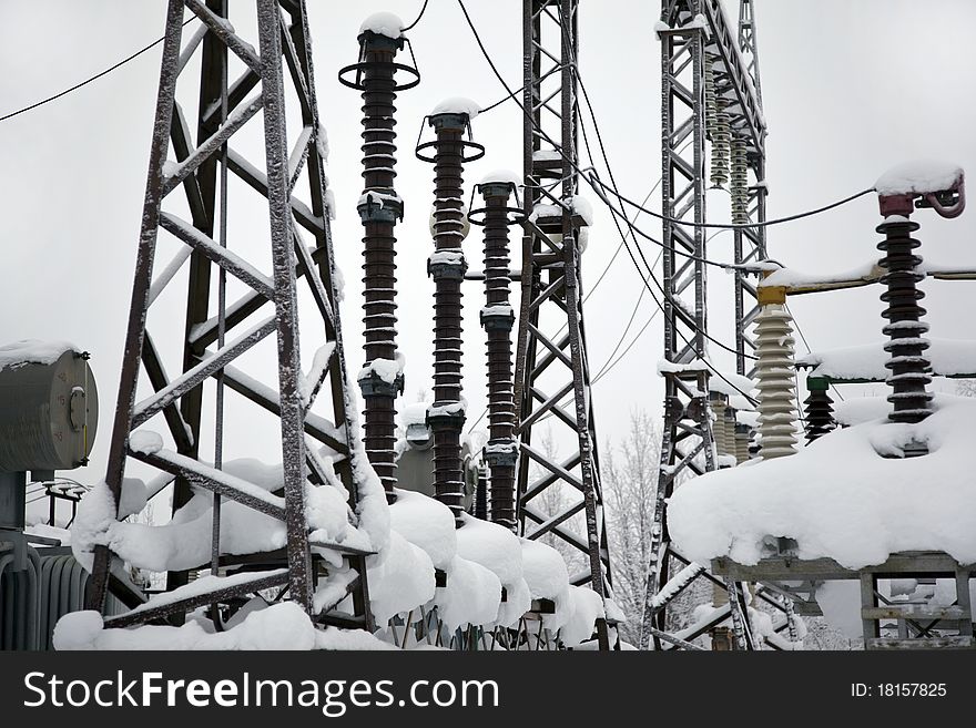 Electrical substation in the snowdrifts. winter landscape