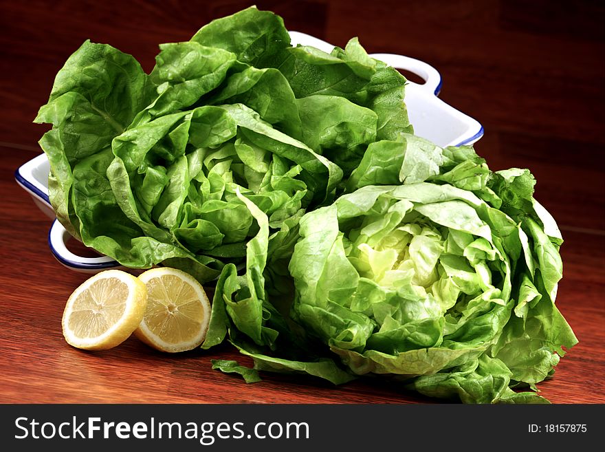 Leaf in the kitchen with salad and lemon