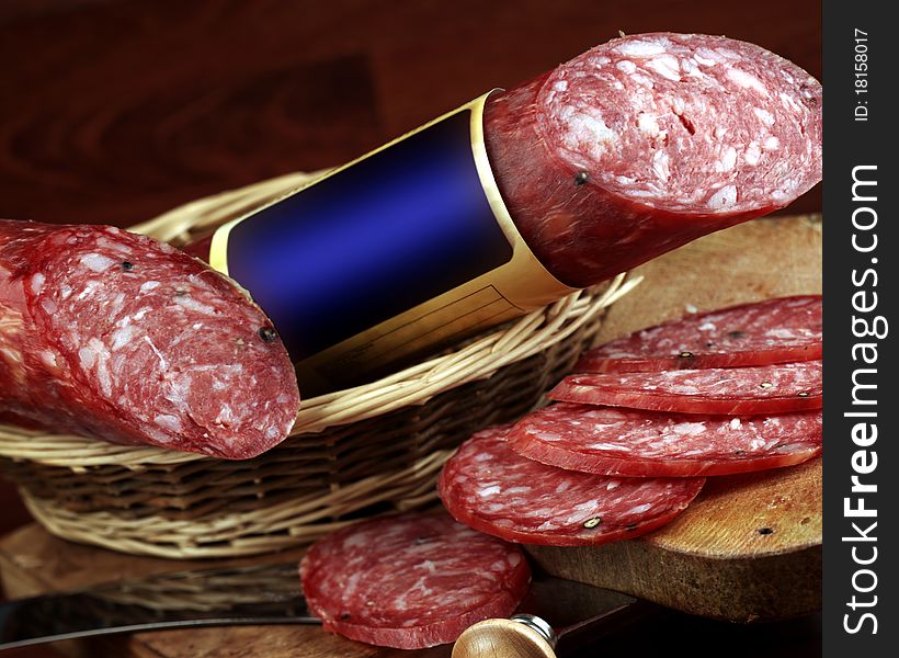 Typical milanese salami in the rustic basket