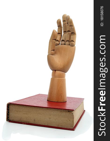 The wooden hand and old book. The wooden hand and old book