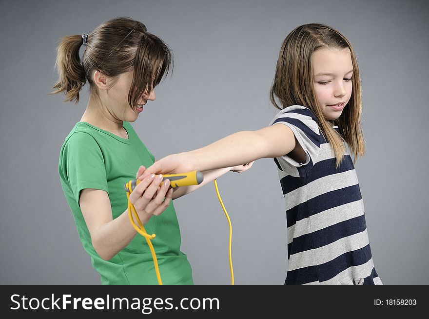 White woman teaching pretty girl jumping rope movements. White woman teaching pretty girl jumping rope movements