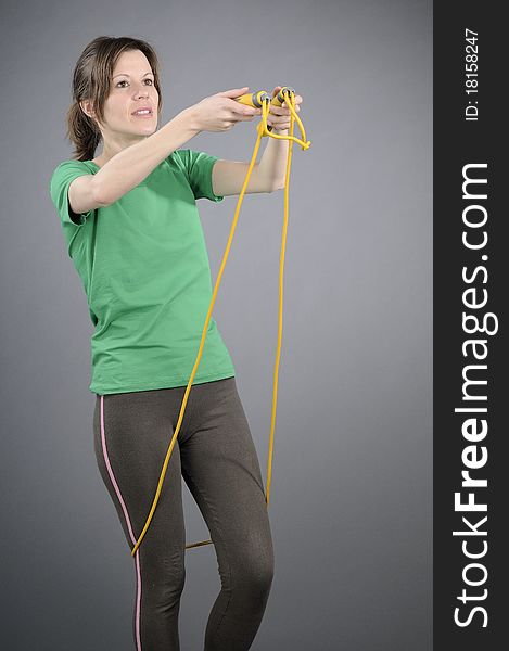 White person exercising with jumping rope. White person exercising with jumping rope