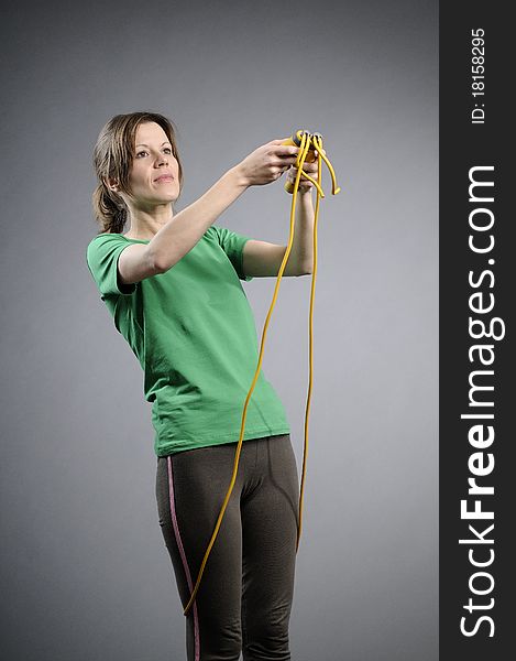 Caucasian woman jumping rope
