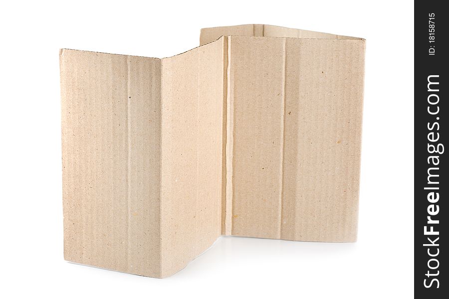 Torn blank cardboard, casting natural shadow on white. Ready for your message. Torn blank cardboard, casting natural shadow on white. Ready for your message.