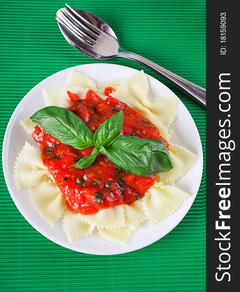 Tasty pasta with tomato and basil