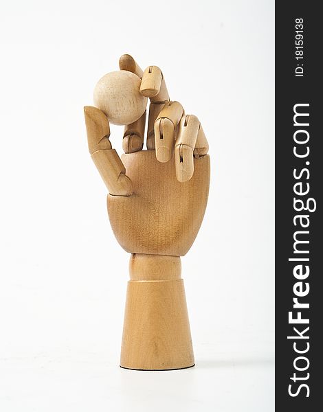 The wooden hand and wooden ball. The wooden hand and wooden ball
