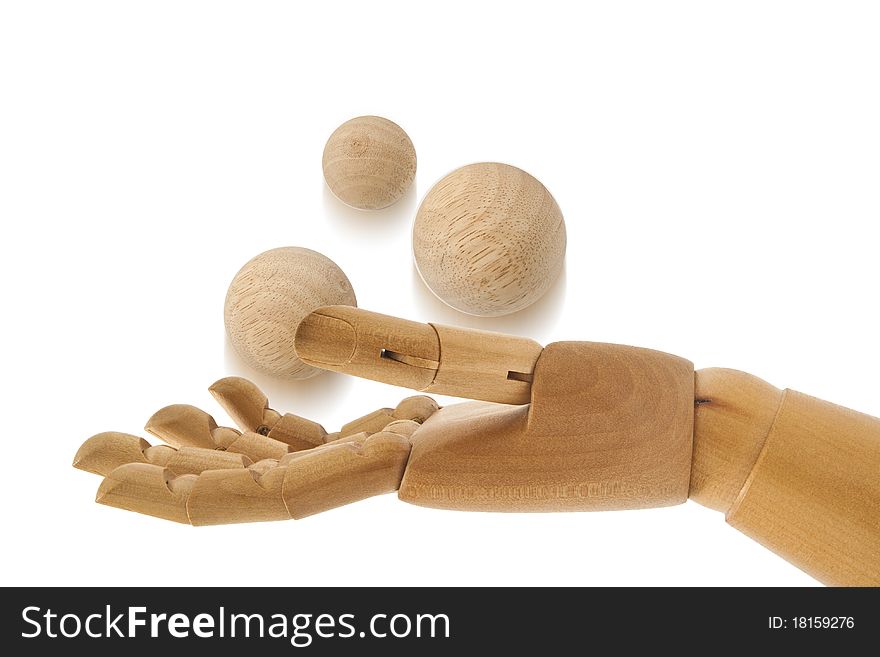 Three wooden balls on wooden hand. Three wooden balls on wooden hand