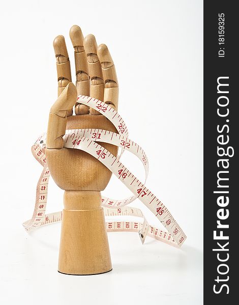 The Wooden hand and tape. The Wooden hand and tape