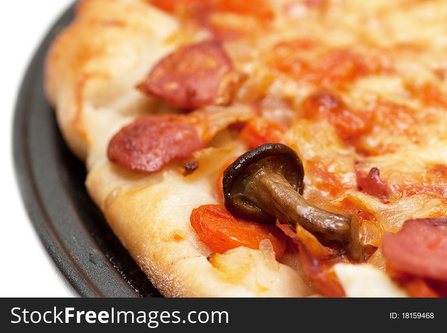 Hot fresh pizza with mushrooms on a baking tray