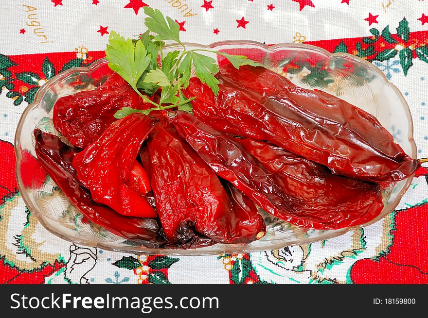 Old withered red pepper on the plate