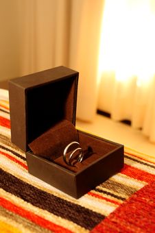 Wedding Rings On The Bed Royalty Free Stock Image