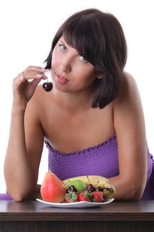 Cheerful Woman Eating Fruit And Berrie Royalty Free Stock Photo