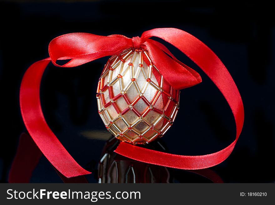 Eggs decorated with beads over the black background. Eggs decorated with beads over the black background