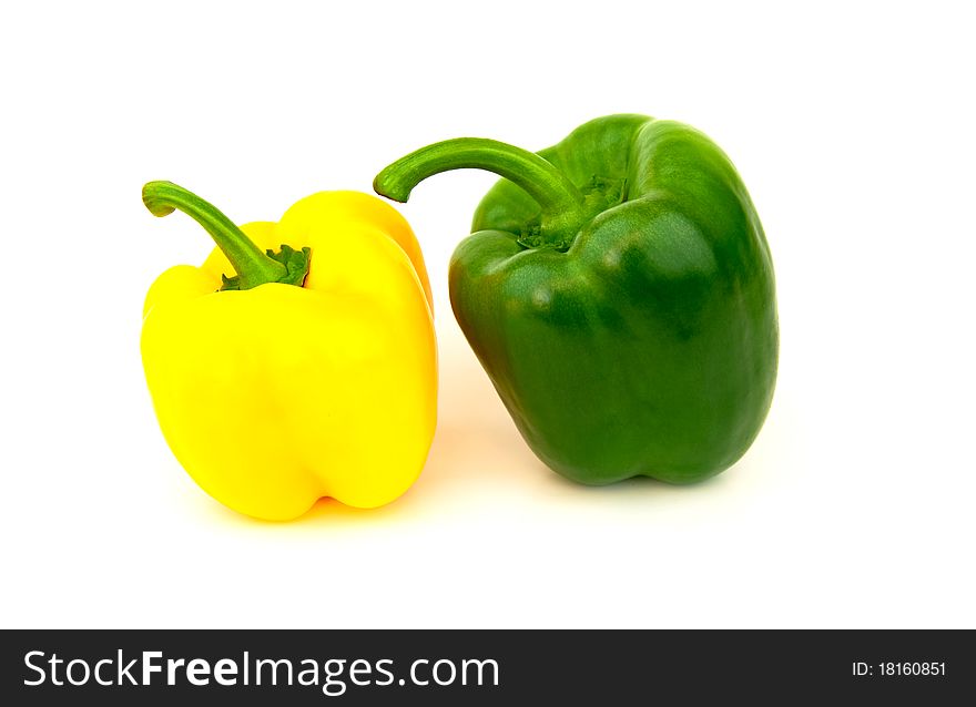 Green and yellow paprika isolated on white background. Green and yellow paprika isolated on white background.