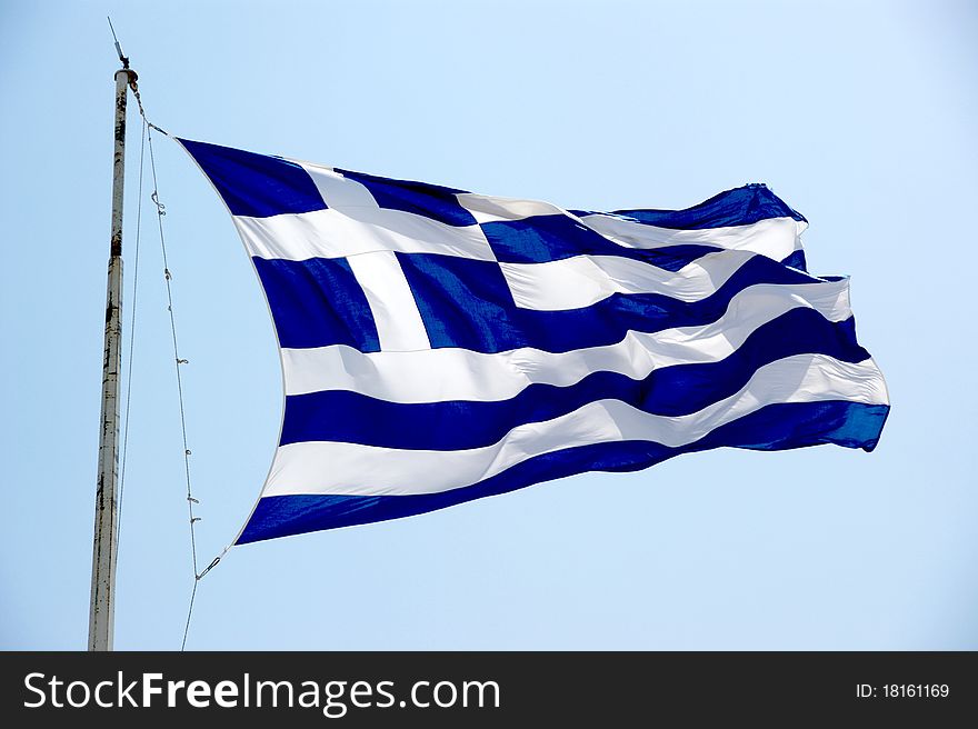 The greek flag in acropolis of Athens. The greek flag in acropolis of Athens.