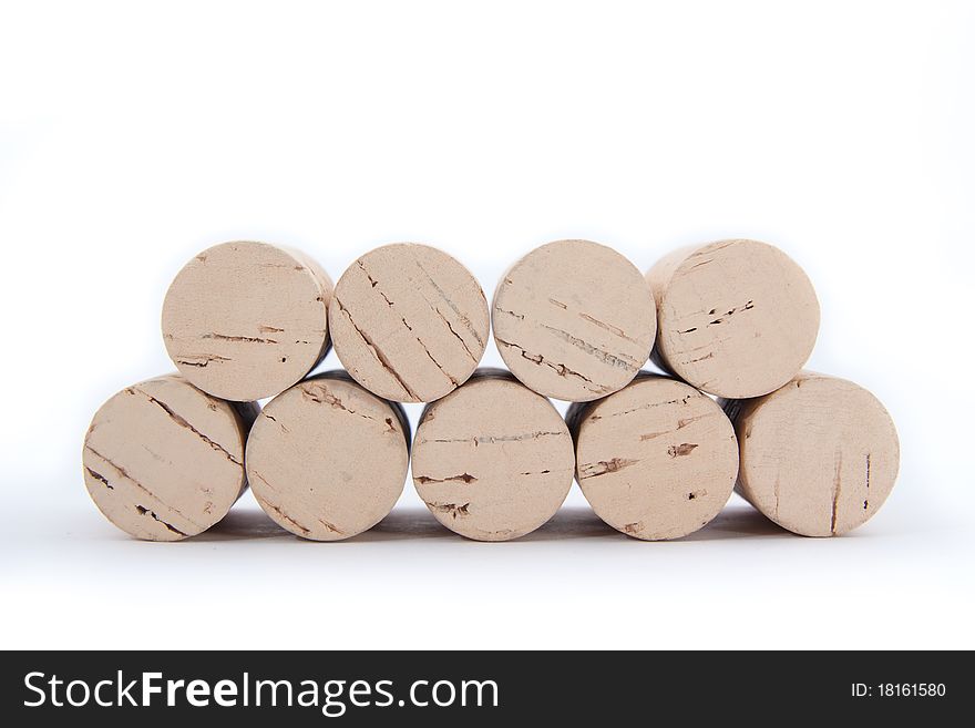 Many wine corks isolated on a white background