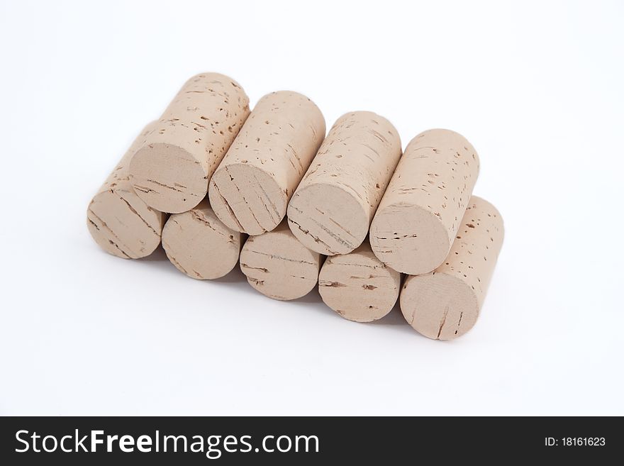 Many wine corks isolated on a white background