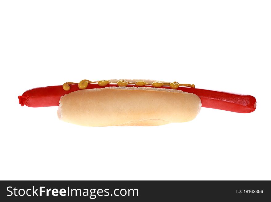 Extra large foot long hot dog and mustard in bun isolated