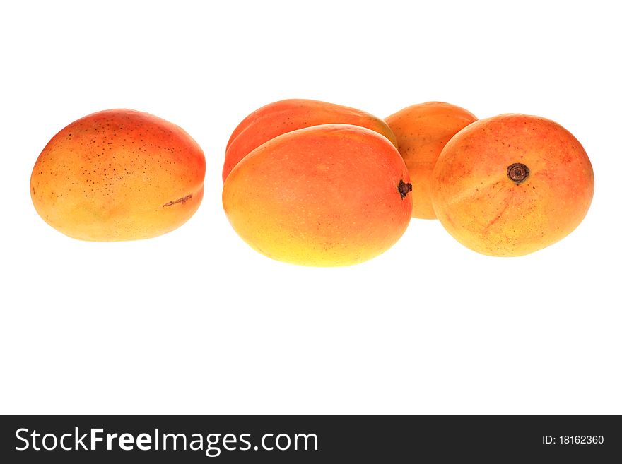 Group of fresh mangoes isolated over white