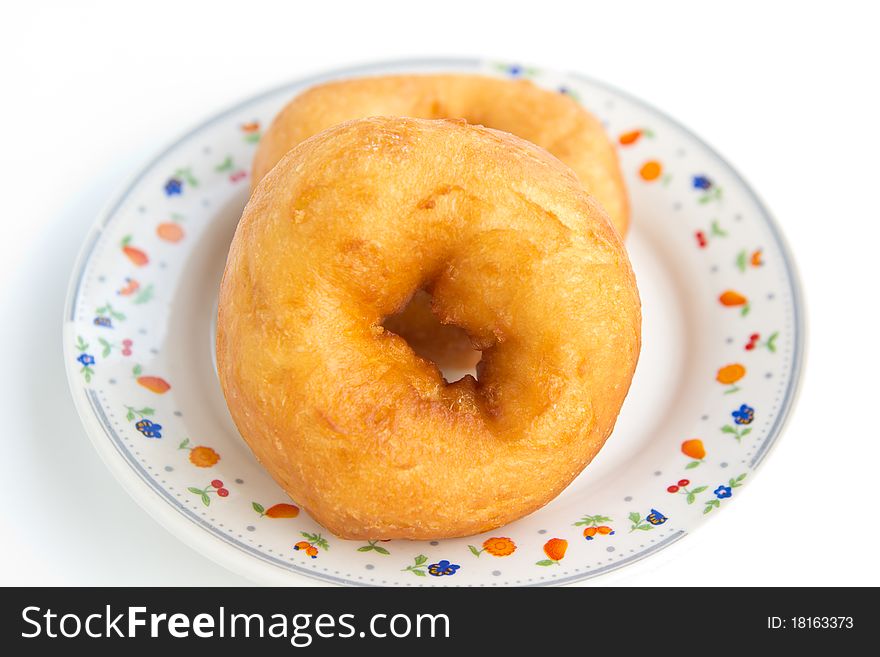 Two donut in dish on white background