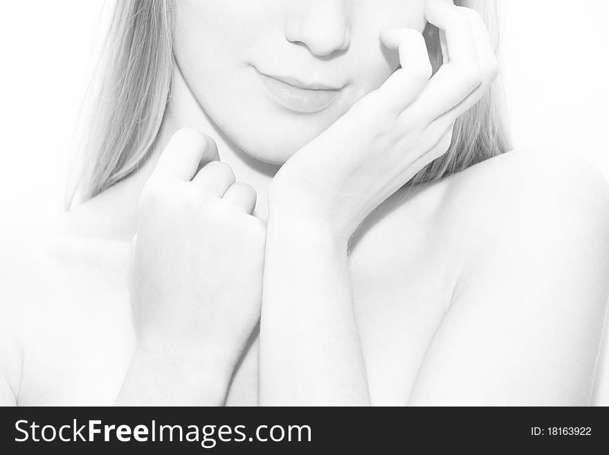 Young blond woman shoulder on white background