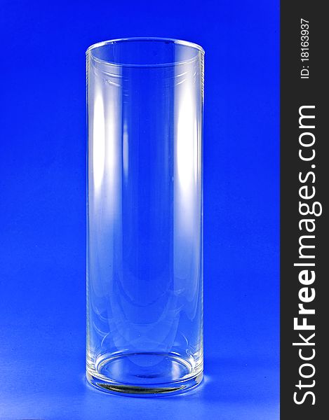 Tall glass on blue for background