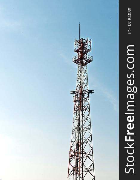 Communication tower over a blue sky. Communication tower over a blue sky.