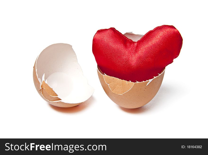 Red Heart Shape In Egg Shell Isolated On White