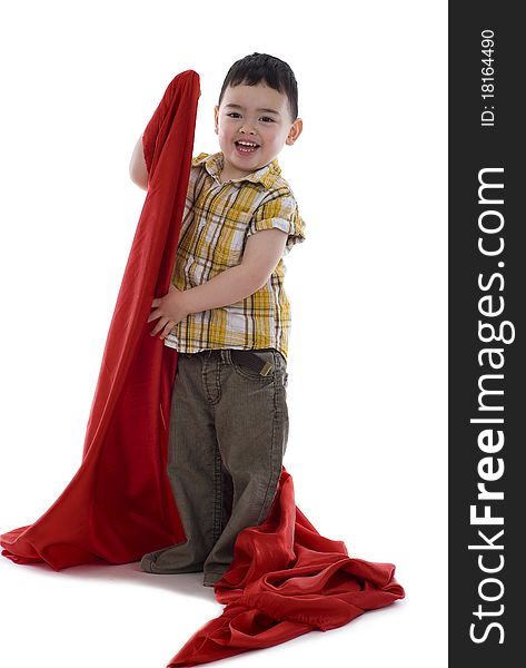 Happy little boy with red silk fabric, isolated on white background