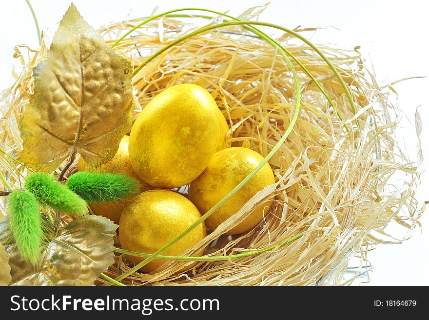 Easter eggs in the nest isolated on white