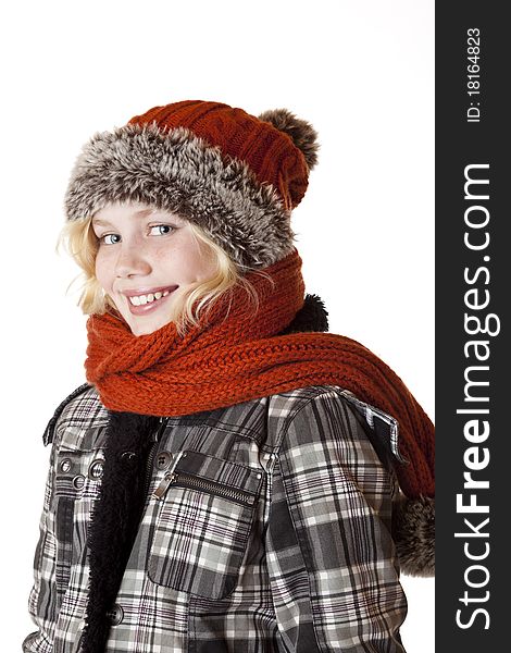 Young blond girl with winter cap and jacket. Isolated on white background.