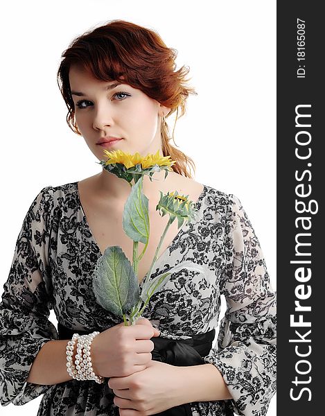 An image of young woman with yellow flower. An image of young woman with yellow flower