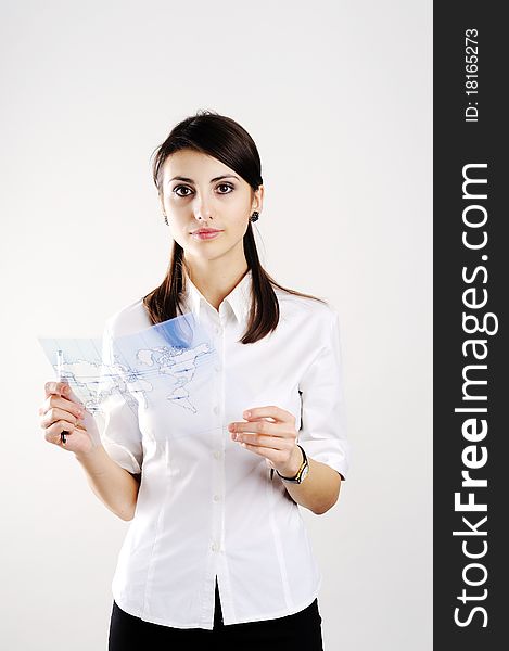 A girl with the map of the world printed on a transparent material. A girl with the map of the world printed on a transparent material