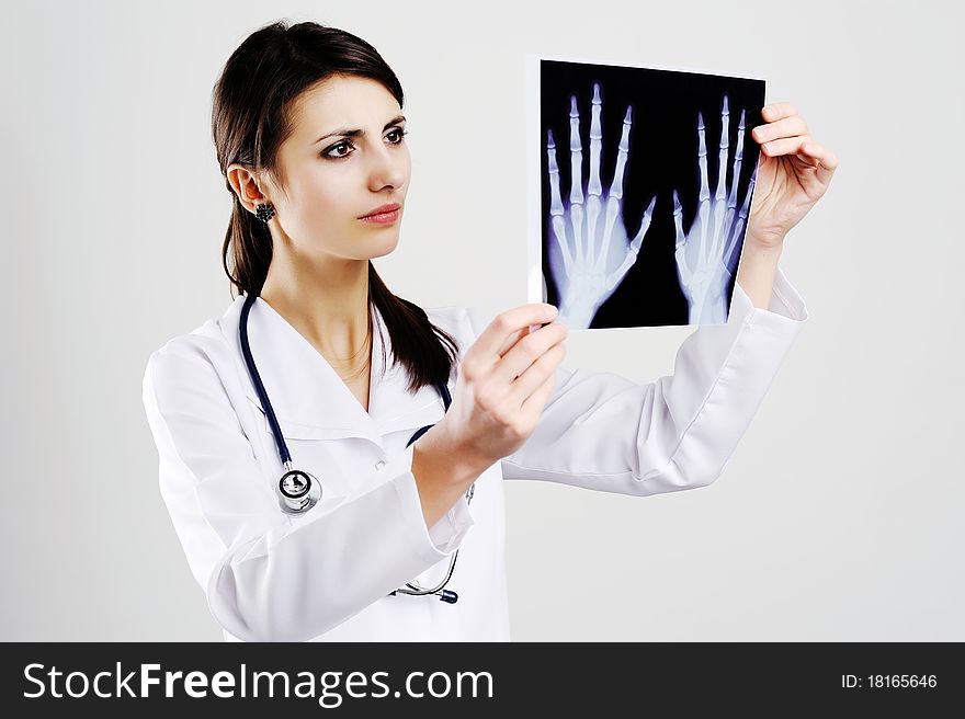 An image of female doctor examing x-ray. An image of female doctor examing x-ray