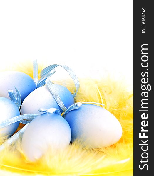 Easter eggs on yellow feathers