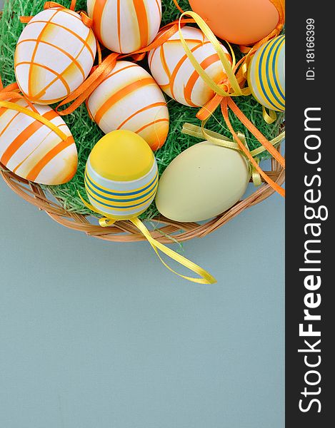 Colorful Easter Eggs basket set on blue background. Colorful Easter Eggs basket set on blue background