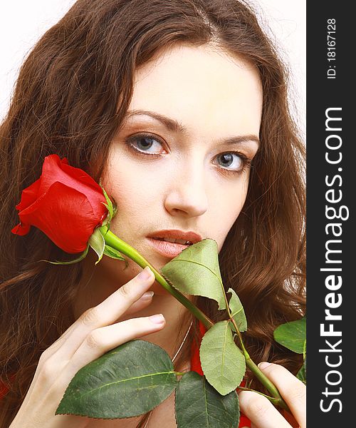 Studio portrait of sensual beautiful woman with rose