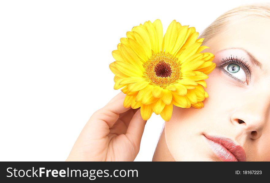 Beautiful young woman with gerber flower isolated on white background