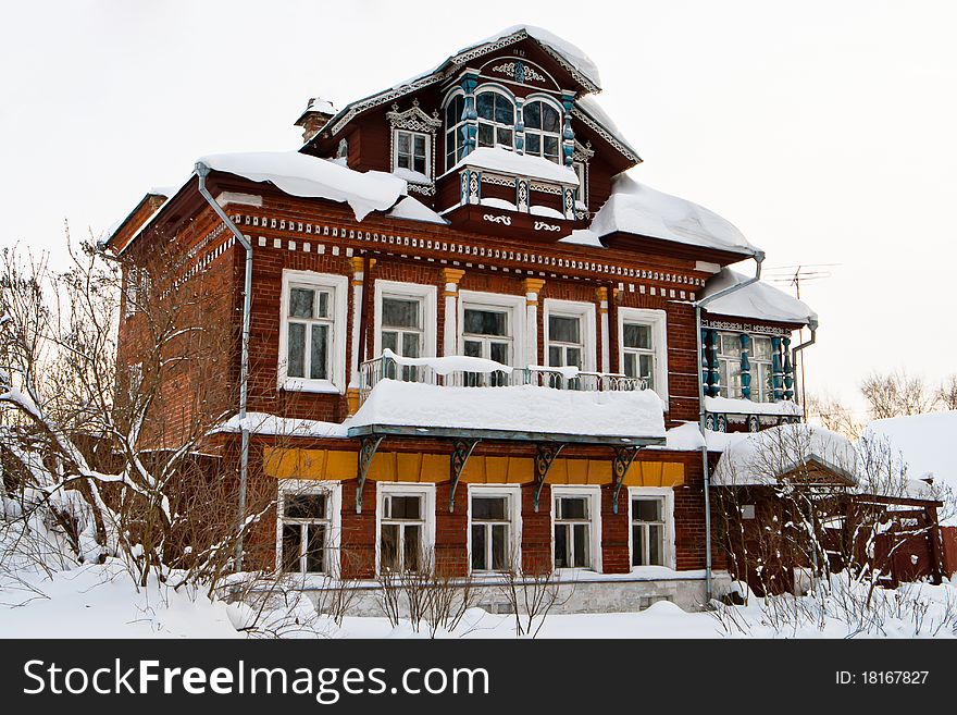 Old brick house with wooden attic