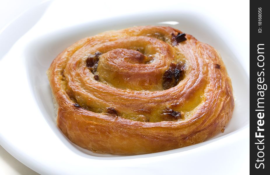 Escargot or pain aux raisines with low depth of field