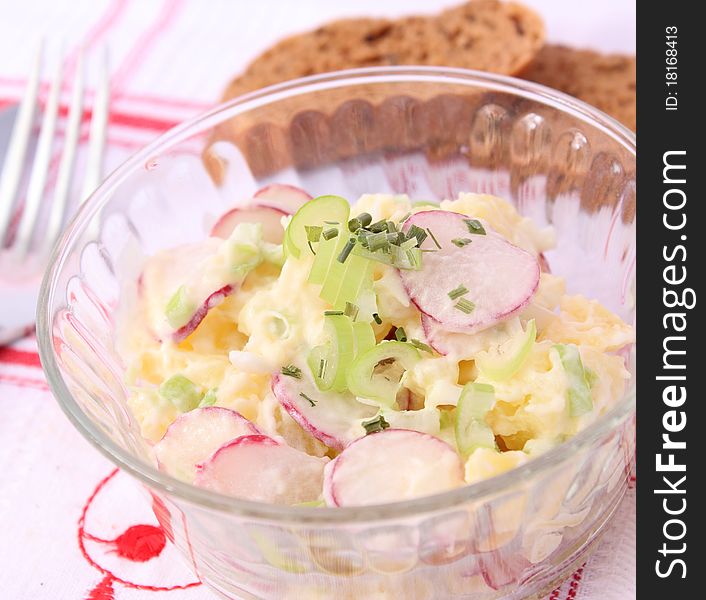 A fresh salad of potatoes and red radish. A fresh salad of potatoes and red radish